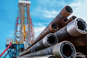 Oil and Gas Drilling Rig. Oil drilling rig operation on the oil platform in oil and gas industry. Top drive system of drilling rig